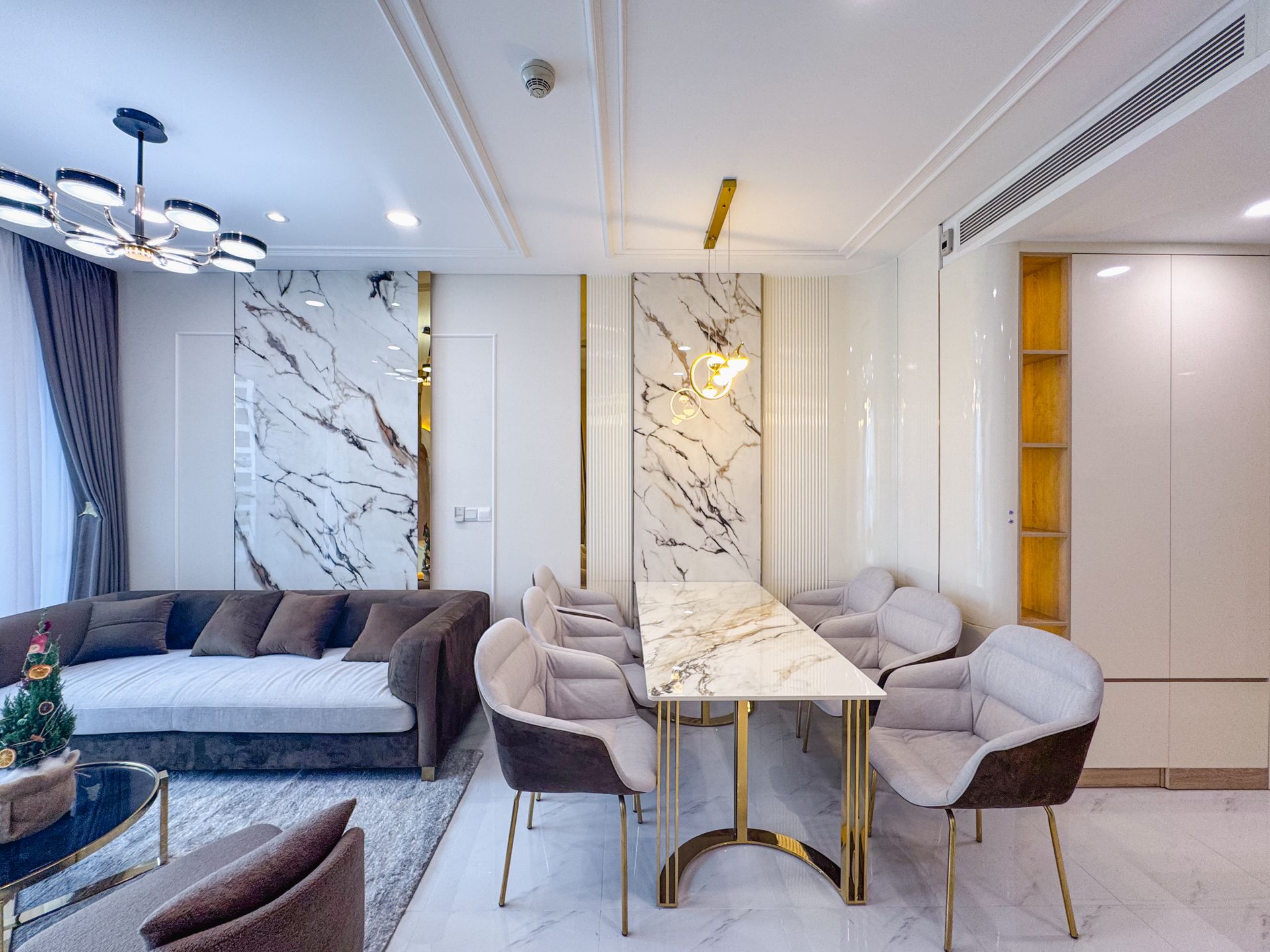 Illustrative elegant shared lounge and dining area with marble detailing